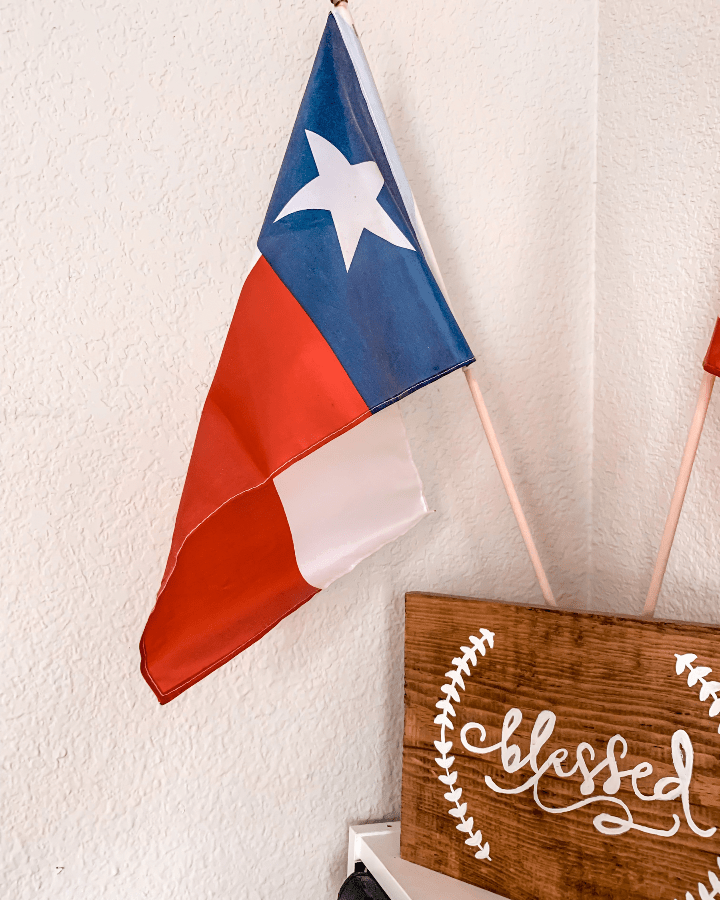 the Texas state flag next to a sign saying blessed